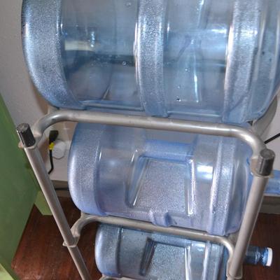 LOT 3.  FIVE GALLON WATER BOTTLES AND STORAGE RACK