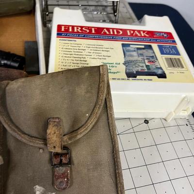 Tray of Survival Emergency Stuff: Matches, Compass, Mess Kit First Aid Kit.