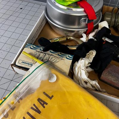 Tray of Survival Emergency Stuff: Matches, Compass, Mess Kit First Aid Kit.