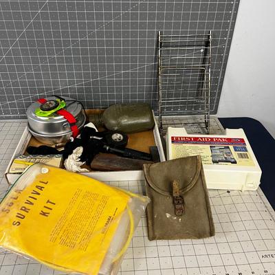 Tray of Survival Emergency Stuff: Matches, Compass, Mess Kit First Aid Kit.