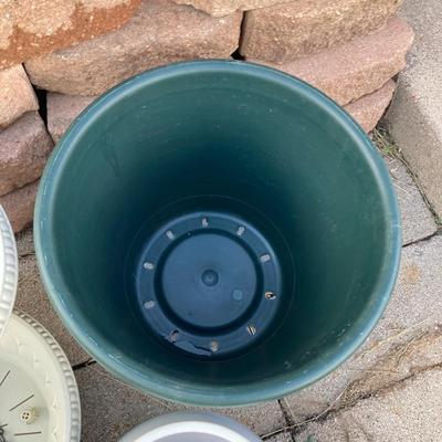 POTS or PLANTERS Whichever you would like them to be and a Flower