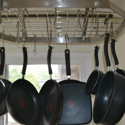 LOT 32. T-FAL PAN SET AND PAN RACK
