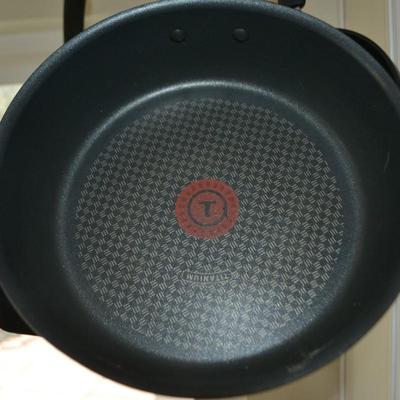 LOT 32. T-FAL PAN SET AND PAN RACK