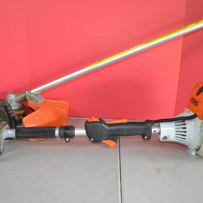 LOT 132. STIHL KOMBI MOTOR  MULTI SYSTEM POWER HEAD AND WEED CUTTER ATTACHMENT