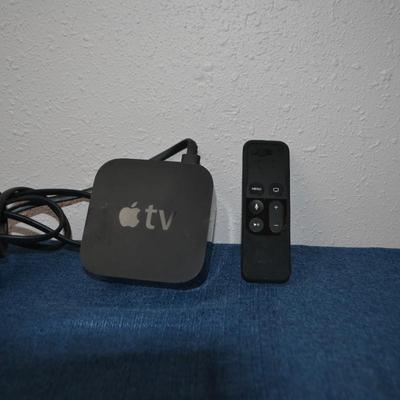 LOT 194. APPLE TV AND REMOTE