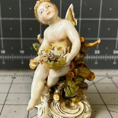 Small German Porcelain Cherub with Flower Basket 