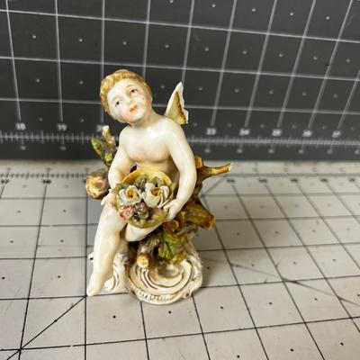 Small German Porcelain Cherub with Flower Basket 