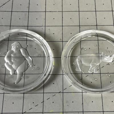 2 Coasters. Clear. Gorilla and Rhino. 