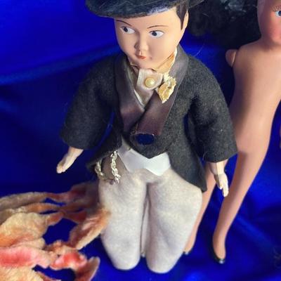 ANTIQUE PIN CUSION AND SOME OLE HEADLESS DOLLâ€™S IN NEED OF NEW RUBBER BANDS