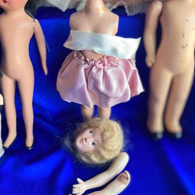 ANTIQUE PIN CUSION AND SOME OLE HEADLESS DOLLâ€™S IN NEED OF NEW RUBBER BANDS