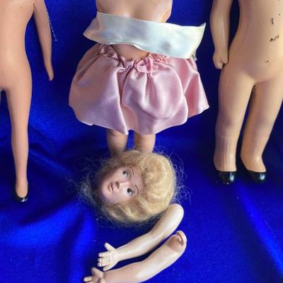 ANTIQUE PIN CUSION AND SOME OLE HEADLESS DOLLâ€™S IN NEED OF NEW RUBBER BANDS