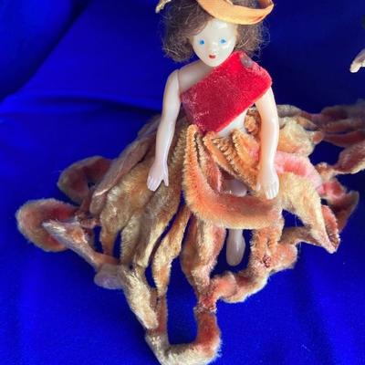 ANTIQUE PIN CUSION AND SOME OLE HEADLESS DOLLâ€™S IN NEED OF NEW RUBBER BANDS