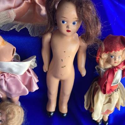 ANTIQUE PIN CUSION AND SOME OLE HEADLESS DOLLâ€™S IN NEED OF NEW RUBBER BANDS