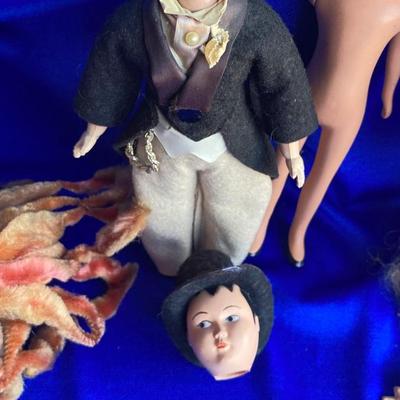 ANTIQUE PIN CUSION AND SOME OLE HEADLESS DOLLâ€™S IN NEED OF NEW RUBBER BANDS