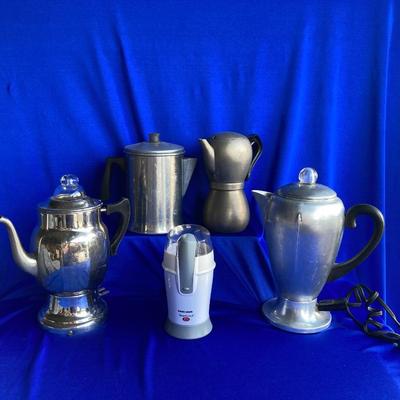 A VARIETY OF VINTAGE COFFEE POTS AND A COFFEE GRINDER TO TRY THEM OUT WITH