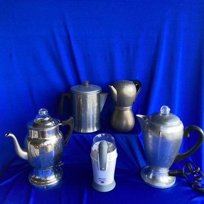 A VARIETY OF VINTAGE COFFEE POTS AND A COFFEE GRINDER TO TRY THEM OUT WITH