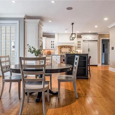 Black Crate & Barrel table with six gray Crate & Barrel chairs