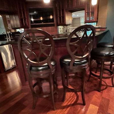 Set of four beautiful swivel leather stools