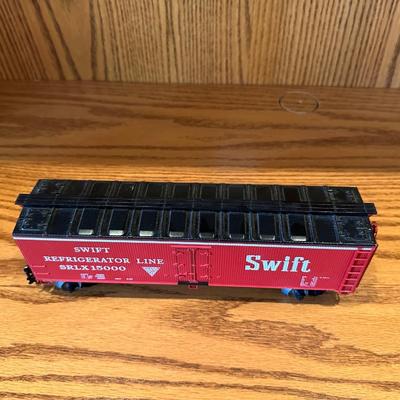 SMALL ANIMAL FIGURES AND A SWIFT TRAIN CAR