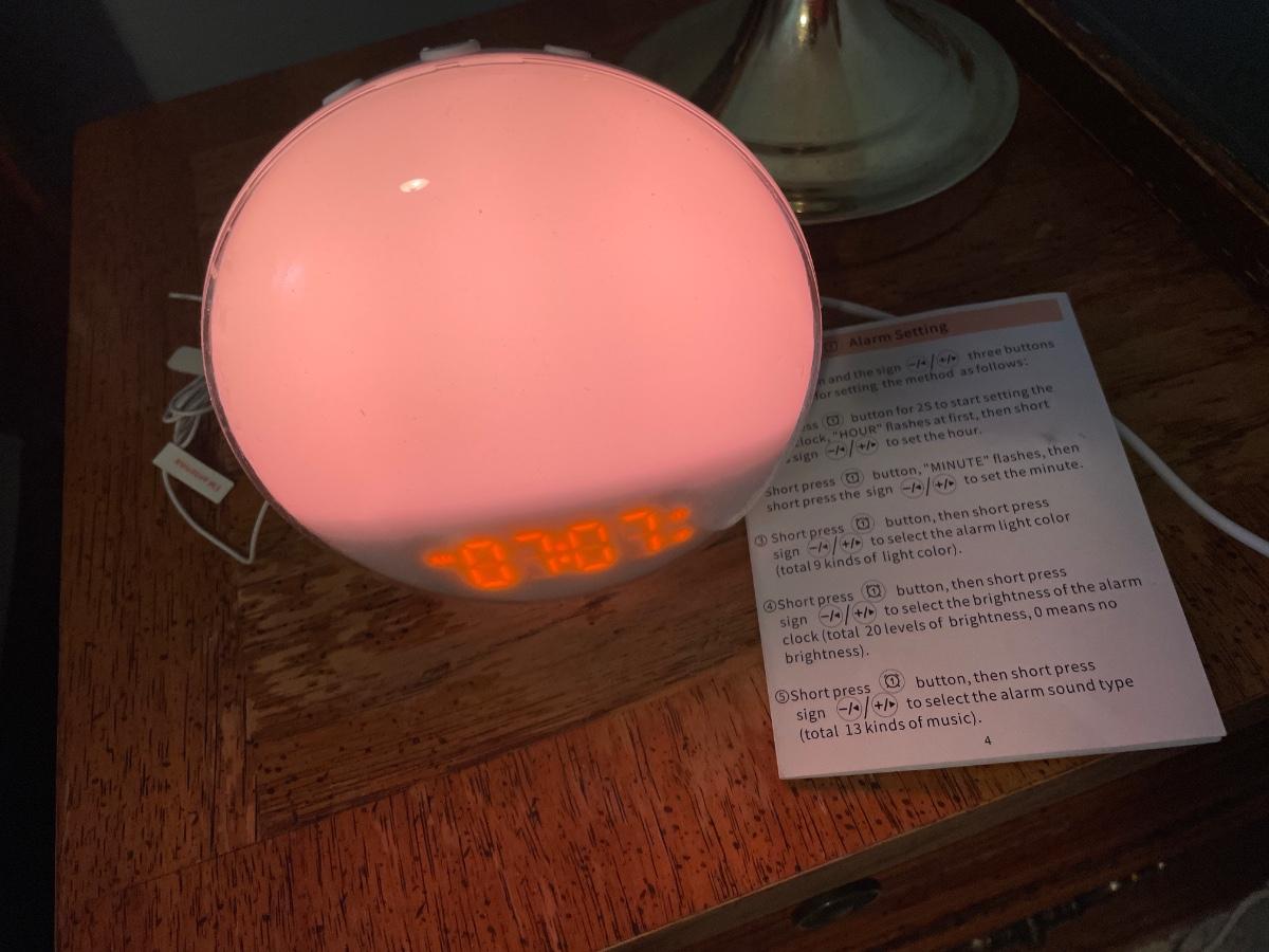 Lighted and vibrating alarm clock