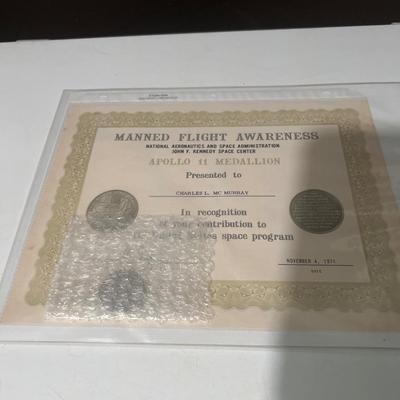 Manned Flight Awareness Apollo 11 Medallion presented to Charles L. MC Murray