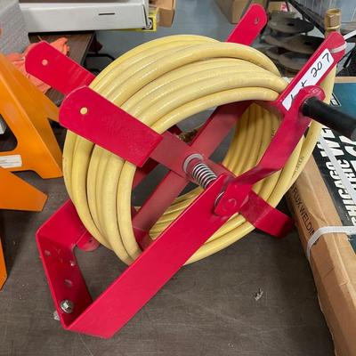 Yellow Air Hose on Red Wall Mount