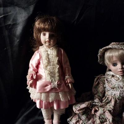 TWO HAND MADE DOLLS AND HAND SEWN CLOTHES