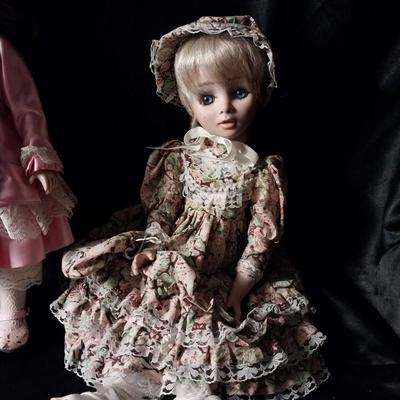 TWO HAND MADE DOLLS AND HAND SEWN CLOTHES