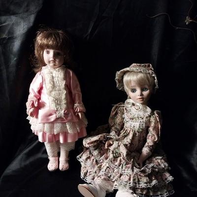 TWO HAND MADE DOLLS AND HAND SEWN CLOTHES