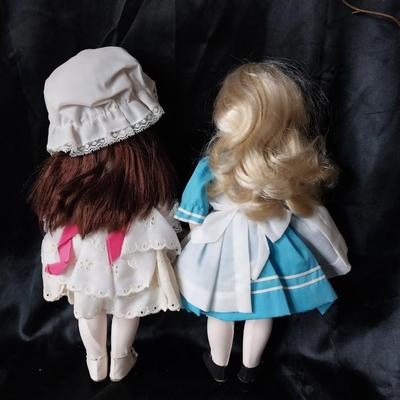 THREE PORCELIAN DOLLS WITH  HAND SEWN OUTFITS