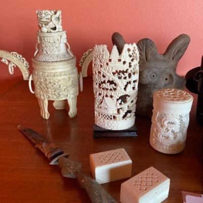 Collection of carved bone pieces.
