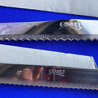 A BRAND NEW SET OF GINSU KNIFES, COOK BOOKS AND SOME OTHER UTENSILS