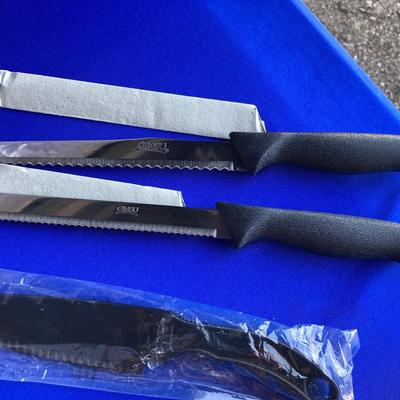 A BRAND NEW SET OF GINSU KNIFES, COOK BOOKS AND SOME OTHER UTENSILS