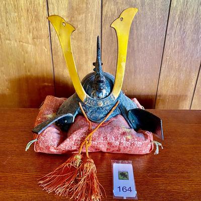 Samurai helmet on silk pillow