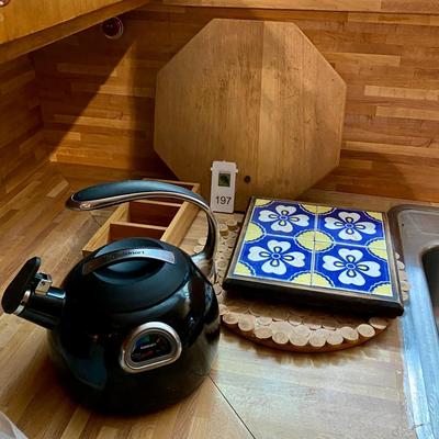 Wood lot including trivets and a tea kettle