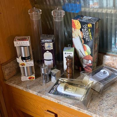 Assortment of pepper mills and can openers