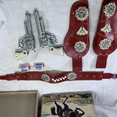 Carnell MFG 1940s Child's  Texas Junior Cowboy Round Up 2 cap Guns with red  leather belt and Holsters