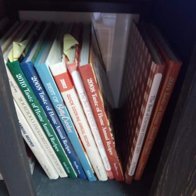 NARROW KITCHEN CABINET FILLED WITH COOKBOOKS