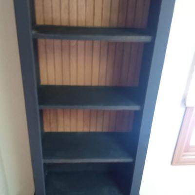 NARROW KITCHEN CABINET FILLED WITH COOKBOOKS