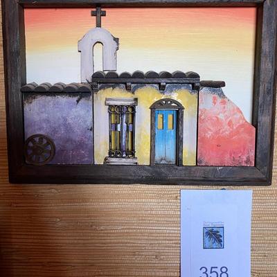 Three-Dimensional painted church on wood.
