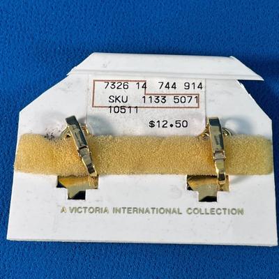 TASTEFUL BLACK AND GOLDTONE STARBURST EARRINGS 