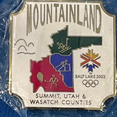 NEW IN PACKET OLYMPIC PIN 2002 â€œMOUNTAINLANDâ€ 
