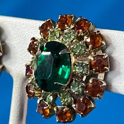 VINTAGE PRONG SET RED, CLEAR RHINESTONES SURROUNDING GREEN CTR.