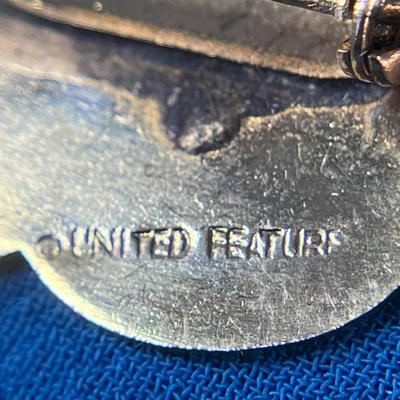 OLDER UNITED FEATURE SNOOPY WITH FOOTBALL ENAMELED PIN