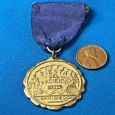 1964 SWIMMING MEDAL PIN ON RIBBON