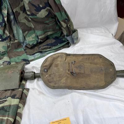 Camouflage Army jacket  M-L marked "Woods"  Folding camp shovel in canvas holder.