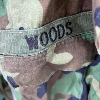 Camouflage Army jacket  M-L marked "Woods"  Folding camp shovel in canvas holder.