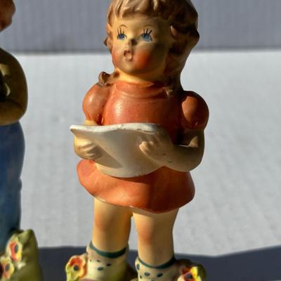 Vintage boy and girl porcelain playing instruments