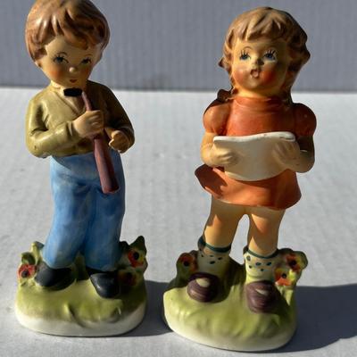Vintage boy and girl porcelain playing instruments