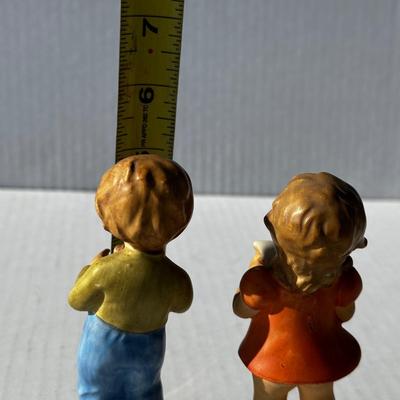 Vintage boy and girl porcelain playing instruments